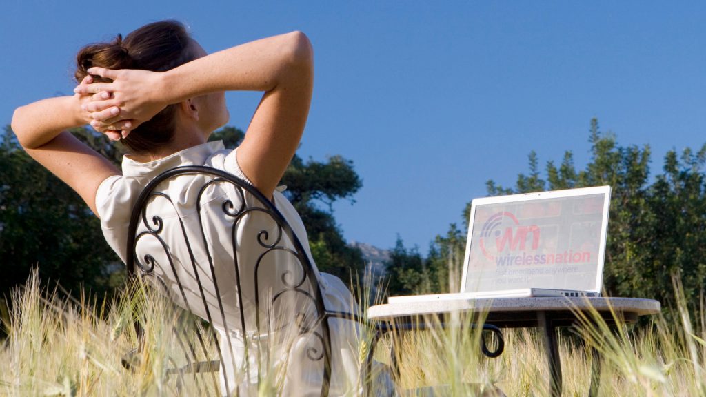 woman outdoors with laptop
