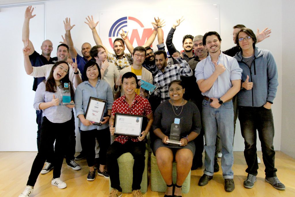 Wireless Nation team members group photo with various awards